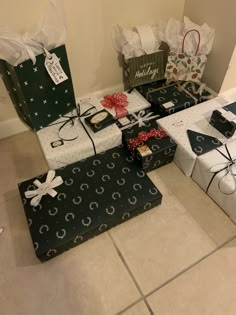 several presents are wrapped in black and white paper