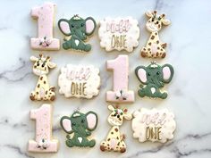 decorated cookies in the shape of numbers for first birthdays