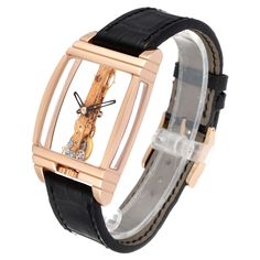 Corum Golden Bridge Classic Rose Gold Skeleton Mens Watch B113/01043. Manual-winding decorated linear movement.  Caliber CO 113. 19 Jewels. 18k rose gold tonneau sceleton case 34.00 x 51.00 mm. Transparent case back. The crown is located at the 6 o'clock position and is engraved with the Corum key. . Scratch resistant sapphire crystal. See thought Transparent  dial with skeleton rhodium-plated baton hands. Black leather strap with 18k rose gold tang buckle. Rose Gold Watch With Skeleton Dial And Rectangular Shape, Rose Gold Watches With Skeleton Rectangular Dial, Rose Gold Rectangular Watch With Skeleton Dial, Yellow Gold Watch With Skeleton Rectangular Dial, Yellow Gold Watch Accessories With Skeleton Rectangular Dial, Luxury Business Watch Accessory With Rotating Bezel, Luxury Business Watch With Rotating Bezel, Elegant Diamond Watch With Skeleton Rectangular Dial, Rose Gold Watch With Skeleton Dial As Gift