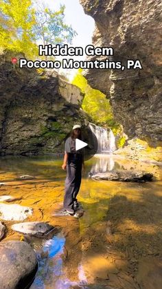 a man standing in the middle of a river next to a waterfall with text overlay that reads hidden gems pocono mountains, pa