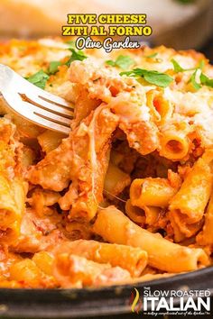 a close up of a plate of pasta with a fork in it and the words five cheese ziti al forno olive garden