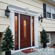 the front door of a house with two christmas trees