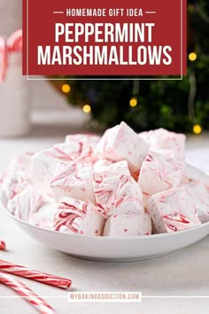 homemade peppermint marshmallows in a white bowl with candy canes