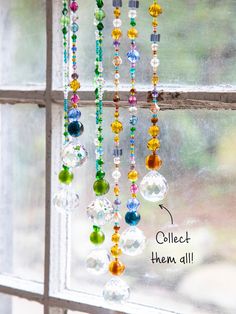 colorful beads hanging from the side of a window