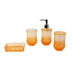 an orange bathroom accessory set with soap dispenser