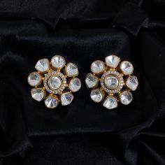 Inspired by Sabyasachi, the Polki Earrings with Kundan Studs feature Uncut Diamond Jadau craftsmanship. These Big India Stud Earrings are a Premium Statement for weddings and Bollywood glamour. They blend traditional elegance with contemporary style, making them a luxurious and meaningful gift for any special occasion. *𝐏𝐑𝐎𝐃𝐔𝐂𝐓 𝐃𝐄𝐓𝐀𝐈𝐋* * Material: Brass * Plating: Gold Plated * Stone: Semi Precious Kundan & Polki *𝐃𝐈𝐌𝐄𝐍𝐒𝐈𝐎𝐍𝐒* * Weight: 8 gm Each, Diameter: 1.1 Inches (Push Formal Silver Cutdana Earrings, Formal Gota Work Jewelry For Diwali, Traditional Round Diamond Earrings For Festive Occasions, Festive Gold Cluster Earrings, Kundan Bridal Earrings With Stone Work For Anniversary, Traditional Silver Diamond Earrings For Festive Occasion, Traditional Diamond Earrings For Wedding And Festive Occasions, White Cutdana Earrings For Celebration, Festive Hand Set White Earrings