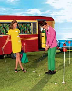 a man and woman playing mini golf in front of a bus with the door open