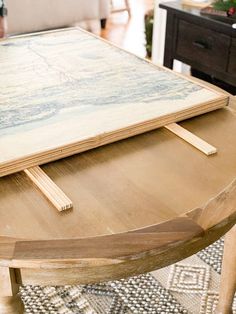 a wooden table with a painting on it