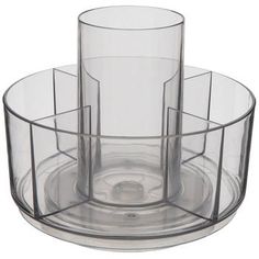 a clear glass holder with three cups inside