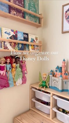 there is a shelf with toys on it and the words how we organize our disney dolls