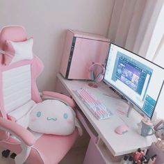 a pink computer chair sitting next to a desk with a monitor and keyboard on it