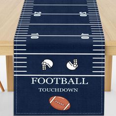 a football themed table runner with the words football touchdown and an image of a football on it