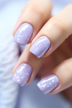 pastel periwinkle nails, periwinkle glitter nails, trendy nail designs, glittery nail ideas, 2024 nail trends, nail art inspiration, nail design ideas, periwinkle manicure, nail fashion, nail style, nail goals, beautiful nails, sparkling nails, periwinkle sparkle, nail inspo, nail trends 2024, nail aesthetics, nail obsession, nail magic, nail therapy, nail vibes, dazzling nails, shimmering periwinkle, trendy nails, nail beauty, glamorous nails Nail Art Lavender, Glittery Nail Ideas, Nails Periwinkle, Lavender Nail Art, Pastel Glitter Nails, Nail Designs Chic, Pastel Periwinkle, Chic Nail Ideas, Sparkly Nail Designs