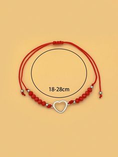 a red string bracelet with a heart charm on it and a white beaded cord