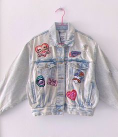 a denim jacket with patches on it