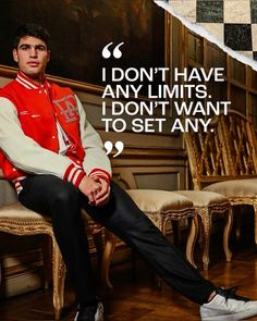 a man sitting on top of a wooden chair next to a wall with a quote above it