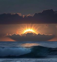 the sun is setting over the ocean as waves crash in front of it and some clouds