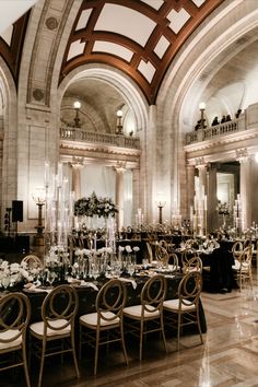 an elegantly decorated banquet hall with tables and chairs