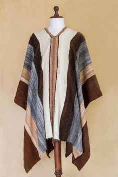 Warm shades of brown, grey and ivory evoke Andean fields in Autumn. Working in luxurious alpaca, Faustino Maldonado creates a men's poncho with wide bands of earthen colors. The warm but lightweight garment is woven by hand on a traditional loom. Handwoven Alpaca Poncho For Fall, Fall Handwoven Alpaca Poncho, Artisan Alpaca Poncho For Fall, Handwoven Brown Poncho For Winter, Brown Alpaca Shawl For Fall, Handwoven Brown Poncho For Fall, Brown Alpaca Winter Cape, Handwoven Brown Fall Poncho, Traditional Brown Cape For Fall