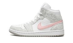 The Women’s Air Jordan 1 Mid SE “Heather Grey/Pink” is a casual colorway of the women’s version of Michael Jordan’s first signature shoe.  From Jordan Brand’s Spring 2022 collection, the “Heather Grey/Pink” features heather grey canvas overlays against a crisp white tumbled leather base.  A pink leather Swoosh is found on both sides of the shoe and a tonal “Wings” logo is located on the collar.  On the tongue, a silver Jumpman with “Air” branding adds a classic Jordan 1 look.  Underfoot, a white rubber midsole and grey outsole complete the look. Pink And Grey Jordans, Womens Air Jordan 1, Womens Air Jordan, Pink Jordans, Grey Jordans, All Jordans, Air Jordans Women, Fun Shoes, Preppy Shoes