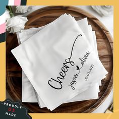 three personalized napkins on a plate with flowers