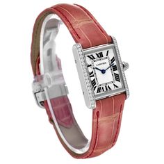 Cartier Tank Louis White Gold Diamond Pink Strap Ladies Watch WJTA0011 Box Papers. Manual winding movement. 18k white gold case 29.5 x 22.0 mm. Circular grained crown set with diamond. Original Cartier factory diamond bezel. Scratch resistant sapphire crystal. Silver guilloche dial with black roman numerals. Sword shaped blue hands. Secret Cartier signature at X. Pink leather strap with 18K white gold deployant buckle. Elegant Rectangular Engraved Watch, Formal Rectangular Cartier Watch Accessories, Formal Cartier Watch Accessories, Rectangular Shape, Cartier Rectangular Watch Accessories For Formal Events, Cartier Rectangular Watch Accessories For Formal Occasions, Engraved Cartier White Gold Jewelry, Elegant Rectangular Engraved Watch Accessories, Cartier White Watch With Rectangular Dial, Classic Engraved White Gold Jewelry