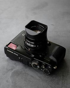 a black camera sitting on top of a table