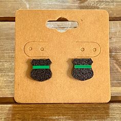 These are our new, Thin Green Line Badge Earrings! Since we have been getting a ton of requests for Military Remembrance/ Conservation Officer earrings, we thought we would make a pair of thin green line badge earrings that are universal, no matter where you live ☺️ Here are the details: -You are purchasing ONE pair of our Thin Green Line Glitter Badge Earrings. -Design features an acrylic badge with a green metallic line representing military as well as conservation officers such as game warden Conservation Officer, Game Warden, Remembrance Jewelry, Earrings Design, Earring Posts, Jewelry Earrings Studs, Post Earrings, Design Features, Matter