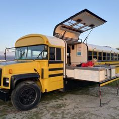 a yellow school bus with its door open