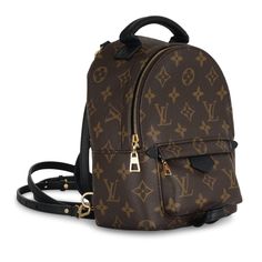 It’s no wonder why the Mini Palm Springs backpack from Louis Vuitton is so sought after. This petite piece is crafted from the brand’s signature monogram canvas and complimented by smooth black leather details. The Palm Springs is versatile as she can be used as a backpack, a crossbody and everything in-between. SPL Exterior Monogram canvas Black leather straps, top handle and tags Gold tone hardware Mini front zip pocket Immaculate condition Interior Black fabric Single compartment Slip pocket Louis Vuitton embossed leather logo tag Immaculate condition Sold with dustbag SPL Height 21.5cm Width 15.5cm Depth 9cm Mini Palm Springs Backpack, Logo Tag, Dior Shoes, Brown Canvas, Leather Logo, Diaper Backpack, The Palm, Casual Backpack, Chanel Handbags