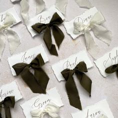 several pieces of paper with bows on them