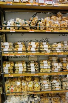 an assortment of baked goods displayed on shelves