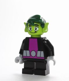 a lego figure with green hair and purple shirt is standing in front of a white background