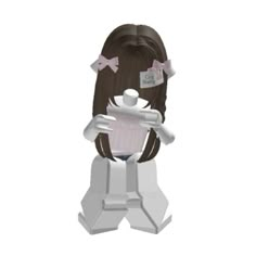 a paper cutout of a girl holding a cupcake in her hands and wearing a bow