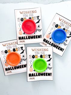 three different colored plates with halloween sayings on them