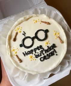 a birthday cake decorated with glasses and confetti