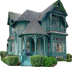 an old victorian style house with green trimmings and a porch on the second floor