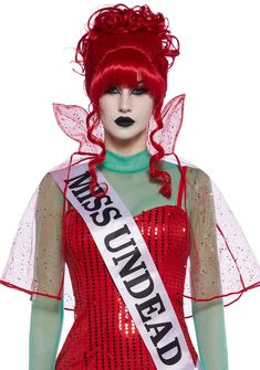 a woman with red hair and makeup is dressed in a costume that says miss usa