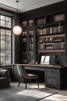 a home office with black bookcases and an l - shaped desk in front of a large window