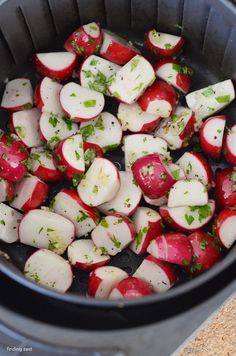 some radishes are being cooked in an air fryer