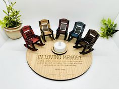 there is a wooden plaque with chairs on it that says in loving memory and the inscription