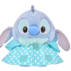 a blue stuffed animal with polka dots on it