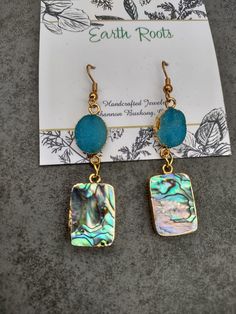 These earrings are perfect for the summer!   They feature turquoise blue druzy gemstone beads with square shaped abalone shell beads. They measure just over 2" in length. They will ship in a gift box or bag via USPS with tracking provided. Rectangular Natural Stone Earrings For Gifts, Abalone Shell, Shell Earrings, Shell Beads, Turquoise Blue, Druzy, Gemstone Beads, Shells, Jewelry Earrings Dangle