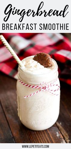 a mason jar filled with gingerbread breakfast smoothie on top of a wooden table