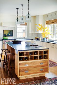 a large kitchen island with two stools in front of it