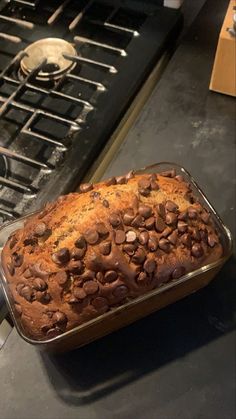 a loaf of chocolate chip bread sitting on top of a stove