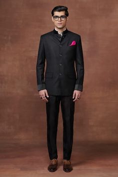 Black wool bandhgala jacket featuring a satin collar and cuff with piping on the collar, Fit: Relaxed Luxury Black Bandhgala For Workwear, Raghavendra Rathore, Radhika Madan, Mira Rajput, Sanya Malhotra, Rhea Kapoor, Rohit Bal, Parineeti Chopra, Black Plain