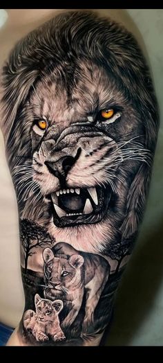 a man's arm with an image of a lion and cub on the side