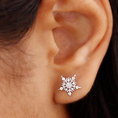 Product Details Prepare to dazzle during the holiday season with these Snowflake Stud Earrings. Adorned with round-shaped Moissanite gemstones, both at the center and on the snowflake design in a prong setting, these earrings are sure to turn heads on cold winter evenings. Product Information SKU SHP-EARRINGS012148231 Length 9.8 mm Width 10.3 mm Weight 1.44 gm (Approximate) MOISSANITE INFORMATION No.of Stones 22 Pieces Total Weight 0.52 Carat (Approximate) Dimension(approx) Round-1.10X1.10 mm-10 Diamond Earing Designs Unique, Modern Diamond Earrings, Band Necklace, Wedding Earring, Gold Earrings Wedding, Gold Diamond Earrings Studs, Art Jewelry Design, Rose Gold Earrings Studs, Gold Snowflake