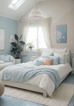 a bedroom with blue walls and white furniture